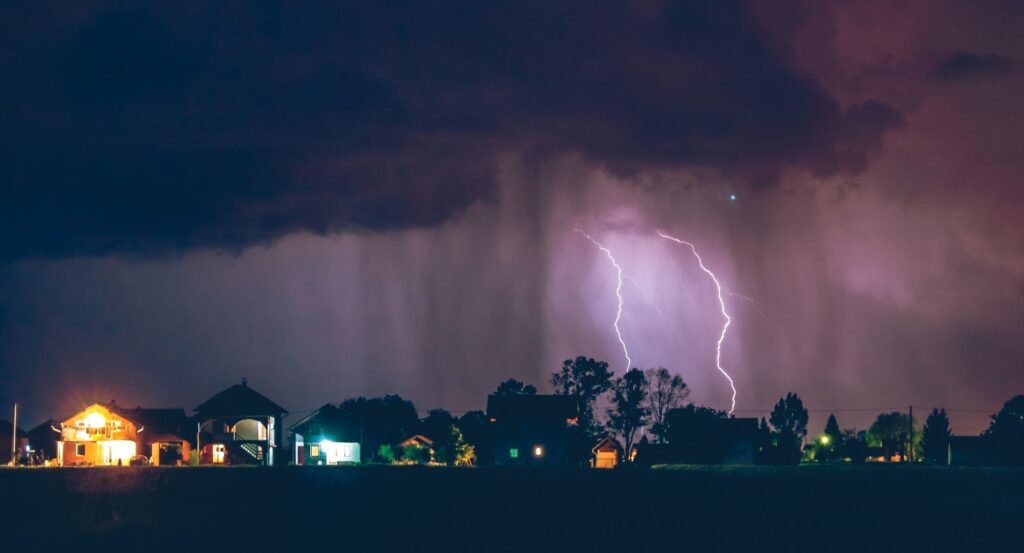 a lightning storm over a neighborhood